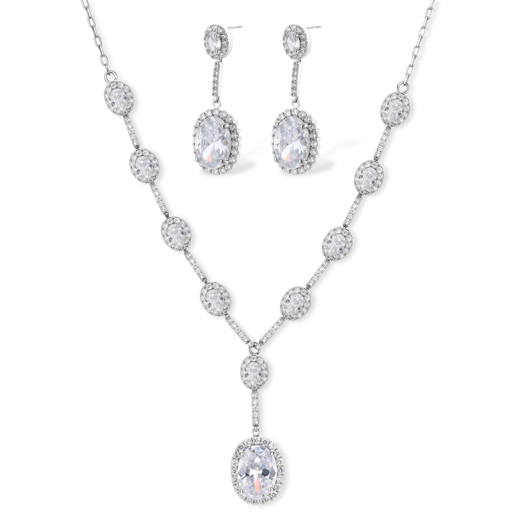 Elegant white gold plated jewelry set with oval cubic zirconia stones in halo settings, featuring Y-necklace and drop earrings.