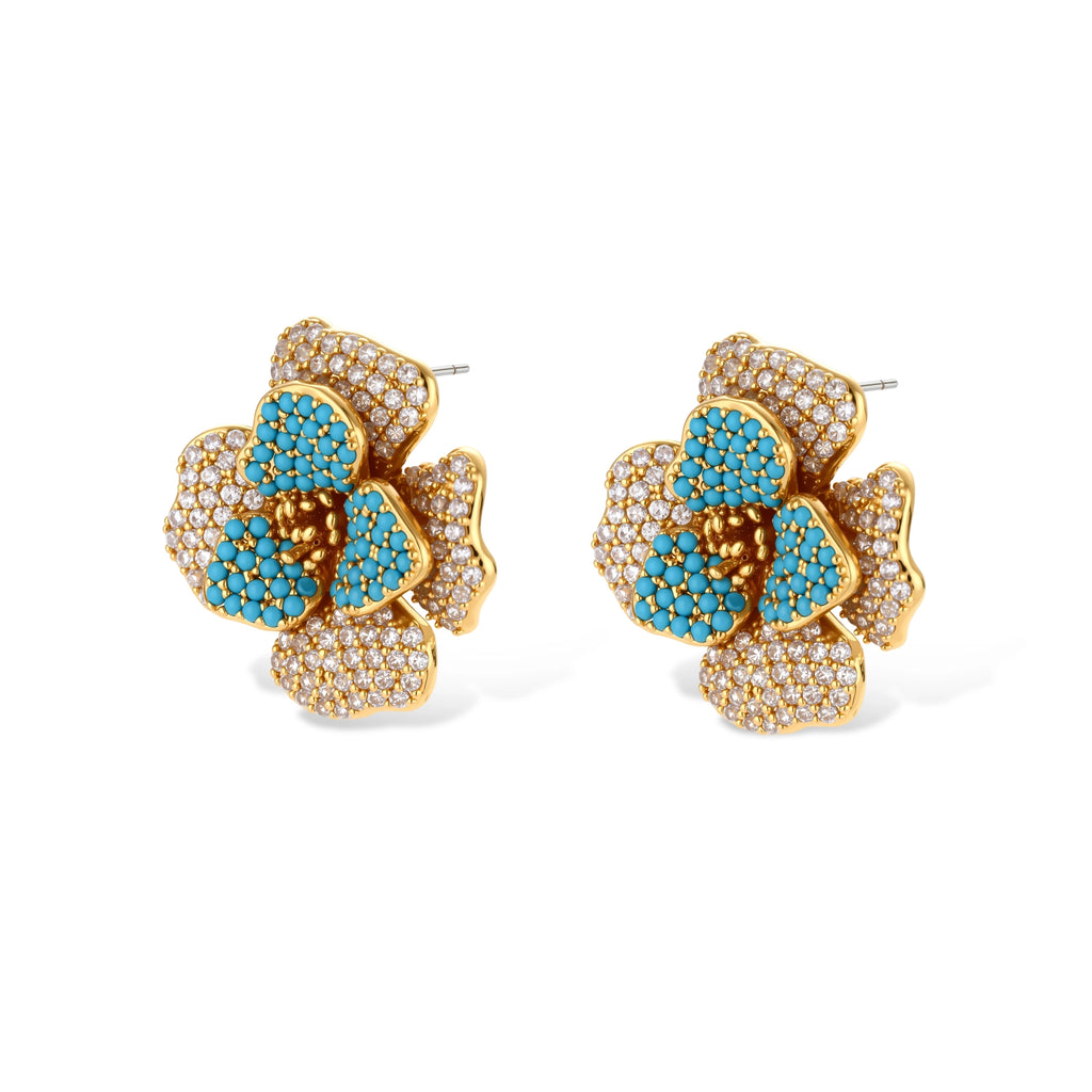 14K gold-plated floral jewelry set with blue cubic zirconia centers and pearl chain details on white background.